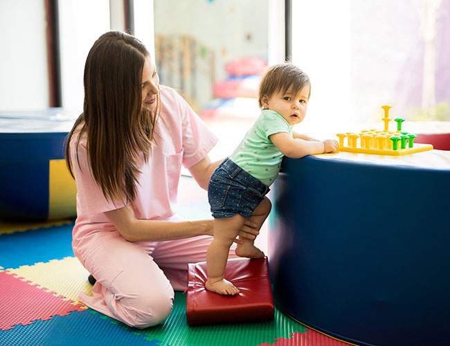 10 month old standing up with support.